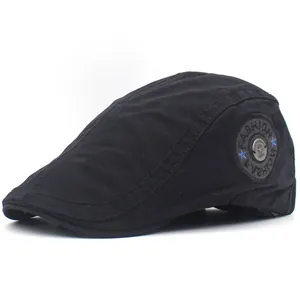 Detail of black cotton flat cap featuring fashion letter patch and star metal button