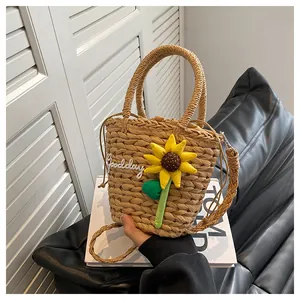 Detail of straw woven bucket bag with 3D sunflower and Goodday embroidery