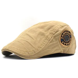 Detailed close-up of khaki cotton twill newsboy cap with fashion embroidery and metal rivet