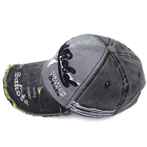 Close-up of washed cotton baseball cap featuring distressed edges and Rebel embroidery