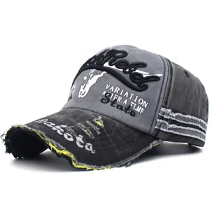 Close-up of distressed brim with frayed edges and 3D embroidery on vintage baseball cap