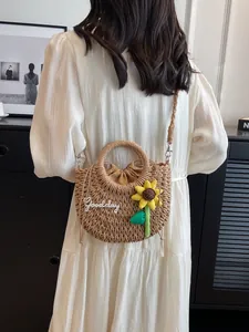 Handwoven straw shoulder bag with sunflower and Goodday embroidery for beach beach trips