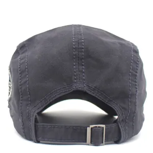 Men's navy cotton flat cap with adjustable metal buckle back and embroidered side patch