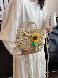 Handwoven straw shoulder bag with Goodday embroidery and sunflower charm for summer