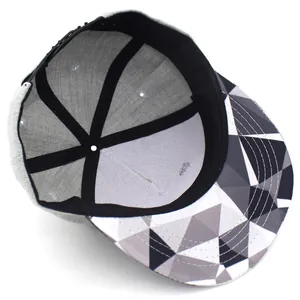 Gray snapback baseball cap with geometric panda color pattern on flat brim and inner lining