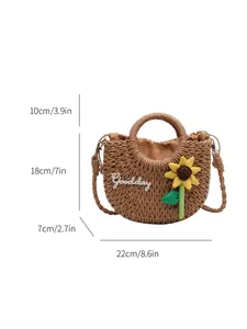 Handmade woven straw crossbody bag with sunflower design and dimension markings