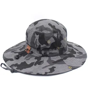 Close-up of camouflage bucket hat showing ripstop fabric and metal ventilation eyelets