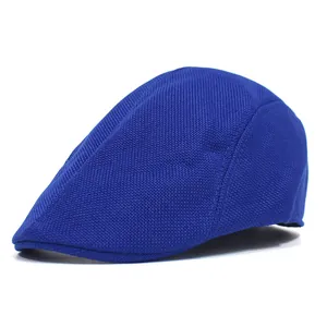 Detailed texture of a breathable blue mesh flat cap for summer outdoor sun protection.