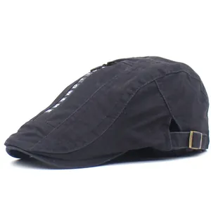 Men's black cotton flat cap with side metal buckles and white lettered webbing decor