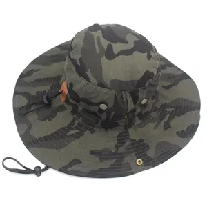 Detail of forest camo boonie hat featuring metal eyelets and adjustable chin strap