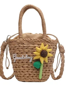 Straw bucket bag with sunflower decor and Goodday embroidery for summer beach vacations