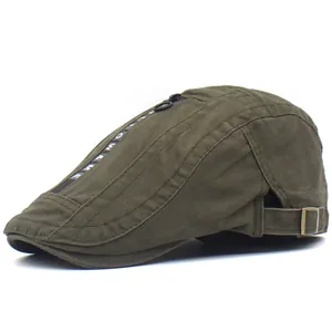 Close-up of olive green cotton ivy cap with zipper tape detail and metal back buckle
