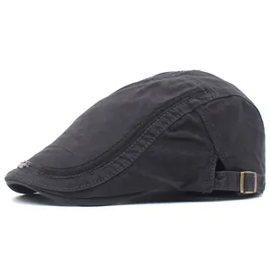 Detail of dark grey ivy cap showing the metal adjustment buckle and decorative stitching