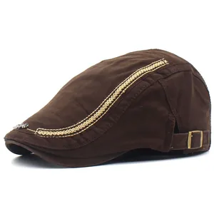 Brown cotton flat cap with zigzag stitching and silver metal logo for men and women