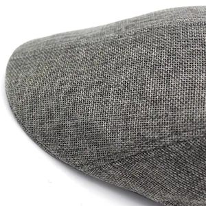 Macro shot of grey mesh fabric texture and weaving detail for outdoor beret cap