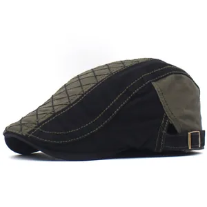 Detail of cotton newsboy cap showing quilted pattern and adjustable metal buckle