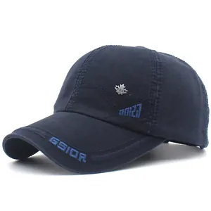 Detail of dark blue cotton baseball cap featuring GSIOR embroidery and metal maple leaf badge