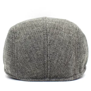 Close-up of breathable grey mesh texture on a vintage flat cap for outdoor sun protection