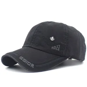 Detail of black cotton baseball cap with maple leaf metal badge and GSIOR embroidery