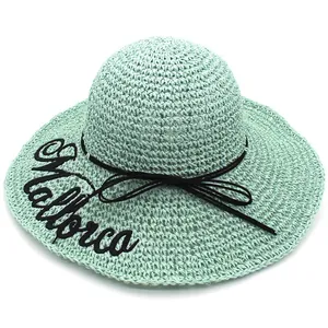 Women's mint green raffia sun hat with wide brim and Mallorca embroidery detail