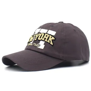 Detailed embroidery of New York 1946 on dark brown cotton baseball cap fabric