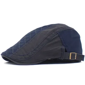 Detail view of cotton flat cap featuring side metal adjustment buckle and quilted pattern