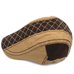 Detailed view of the plaid stitching and adjustable metal buckle on a cotton beret hat