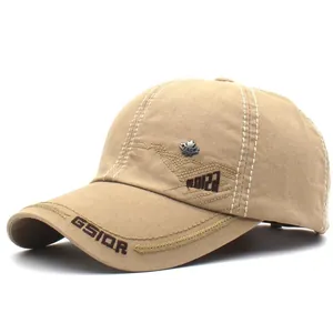 Detailed close-up of khaki cotton baseball cap with maple leaf badge and GSIOR embroidery