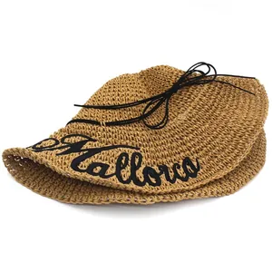 Straw sun hat for women with Mallorca embroidery and black ribbon bow beach accessory