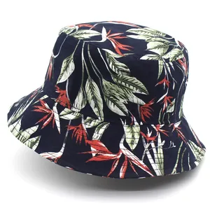Detailed view of tropical floral print and cotton fabric texture on a navy blue bucket hat