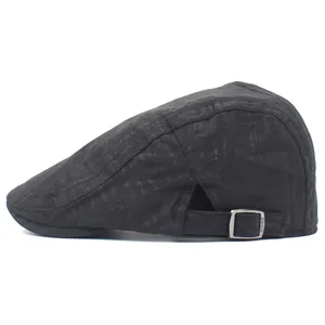 Detail view of the black breathable mesh fabric and adjustable metal buckle on the flat cap
