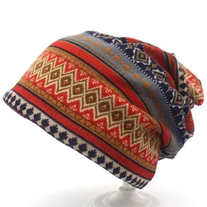 Detailed pattern of ethnic style knit beanie featuring geometric diamonds and red stripes