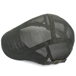 Close-up of olive green mesh beret featuring adjustable leather strap and bronze buckle