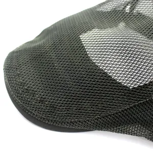 Macro shot of dark green breathable mesh fabric texture on summer ivy cap detail