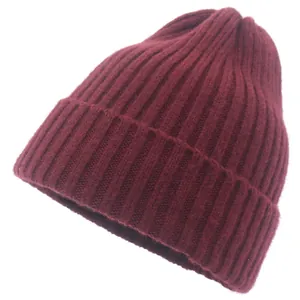 Detail of burgundy ribbed knit beanie showing thick wool texture and warm turn-up cuff design