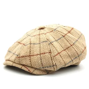Classic khaki plaid wool newsboy cap with vintage British pattern on a white background