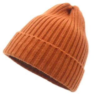 Detailed texture of bright orange vertical ribbed knit beanie for winter warmth