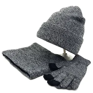 Detailed view of grey knit beanie, neck warmer and touch screen gloves with soft textures