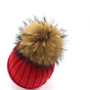 Red rabbit fur knit beanie for women with large fluffy pompom and vertical stripes