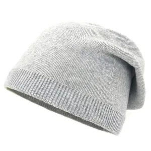 Detail of light grey knit beanie showing soft wool texture and fine ribbed cuff design
