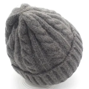 Grey thick cable knit beanie hat for winter with warm ribbed cuff and wool-like texture