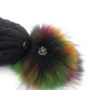 Thick knit winter beanie for women with a colorful faux fur pompom and snap fastener