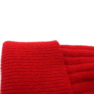Macro shot of red rabbit hair knit hat showing detailed ribbed texture and soft weave