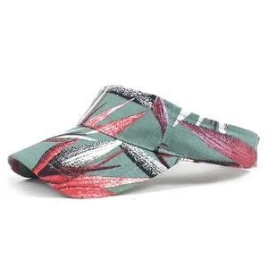 Detail of grey-green sun visor hat with red floral print and durable fabric texture