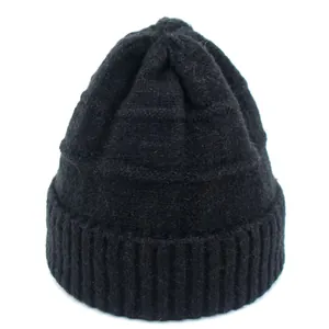 Detailed view of black winter beanie featuring thick knit texture and ribbed cuff