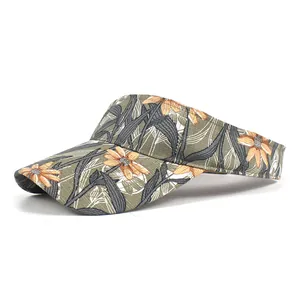 Close-up of dark green sun visor hat with orange floral print and canvas texture