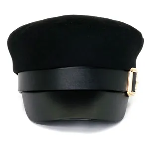 Classic black wool baker boy hat with leather brim and gold buckle detail