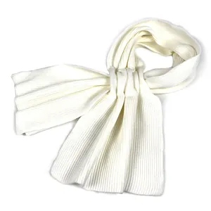 Close-up of ivory knitted scarf featuring soft vertical ribbed texture and fine craftsmanship