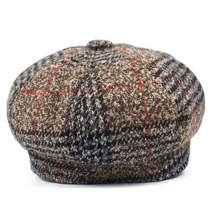 Classic brown plaid newsboy cap for women in vintage British style with wool texture