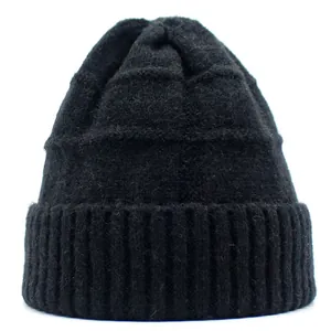 Women's black chunky knit beanie featuring wide ribbed cuff and warm wool texture